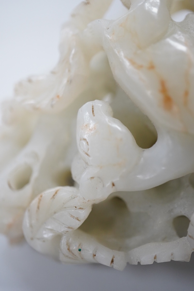A Chinese pale celadon jade 'deer' pebble carving, 7cm high